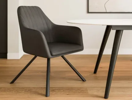 Elegant modern dining arm chair featuring ergonomic wraparound seating, stitched upholstery, and sleek black metal legs.