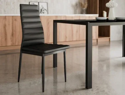Elegant high-back faux leather dining chair in a modern dining room with minimalist furniture and sleek décor.