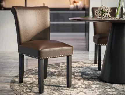 Elegant upholstered dining chair featuring a curved high back, padded seat, and bronze faux leather finish.