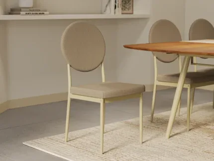Contemporary fabric dining chair featuring a circular backrest, padded seat, and minimalist metal frame in a modern dining room.