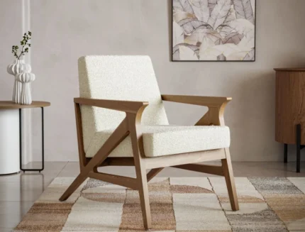 Cream bouclé lounge chair with wooden armrests