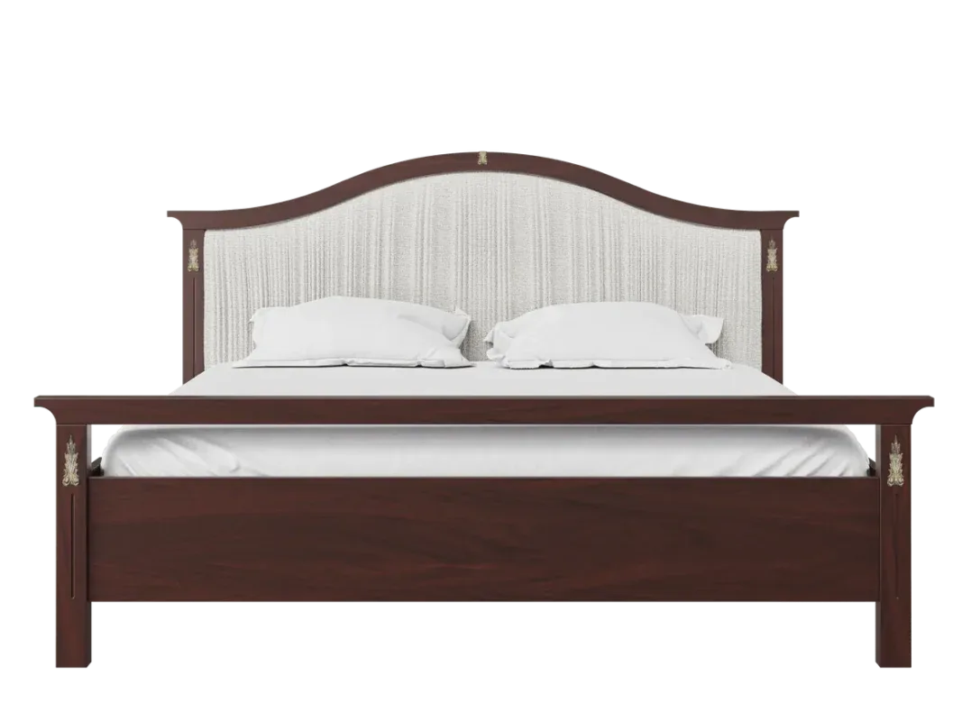 Classic upholstered wooden bed frame with a curved fabric headboard in a luxury bedroom.