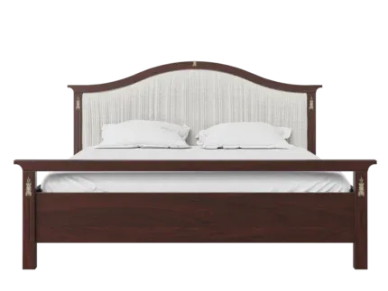 Classic upholstered wooden bed frame with a curved fabric headboard in a luxury bedroom.