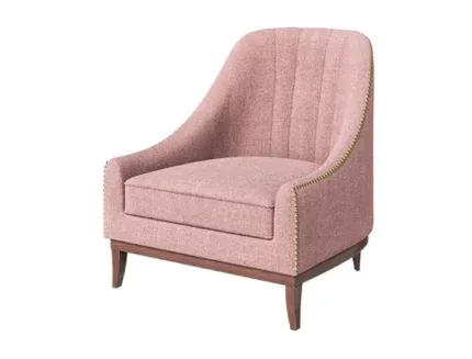 Luna upholstered accent chair in blush pink fabric with wooden legs and curved armrests.