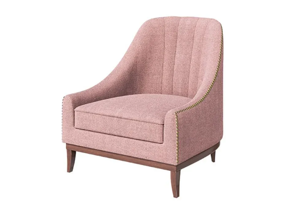 Luna upholstered accent chair in blush pink fabric with wooden legs and curved armrests.