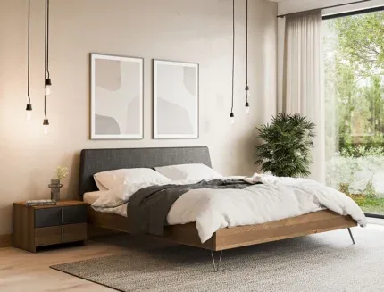 Modern upholstered wooden platform bed with grey fabric headboard in a contemporary bedroom.