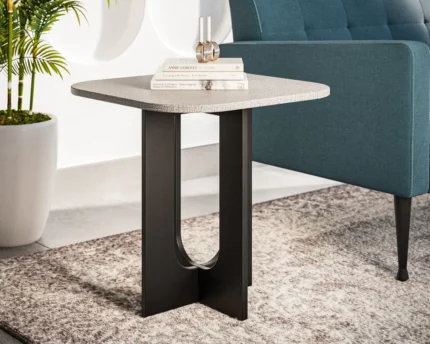 Contemporary accent table beside a blue sofa