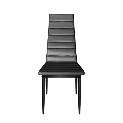 Modern black faux leather dining chair with a high-back design and metal legs beside a contemporary dining table.